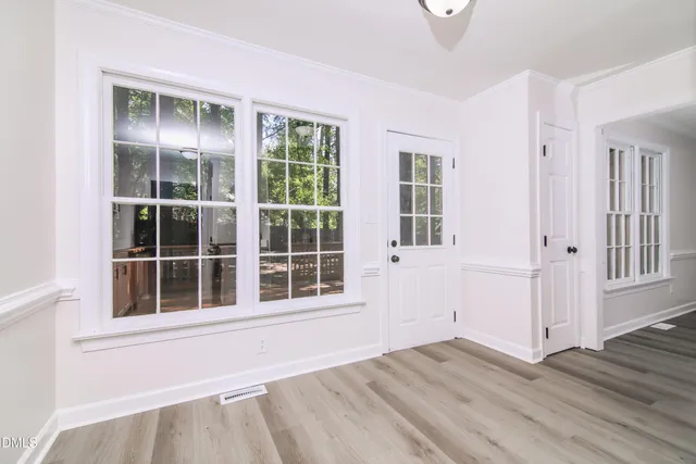 a view of empty room with windows