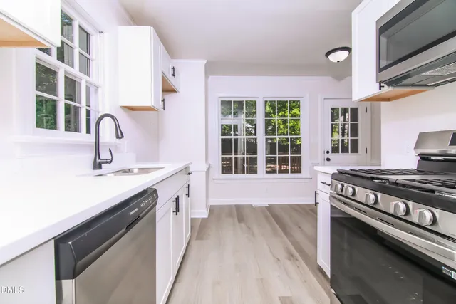 a kitchen with a stove and a sink