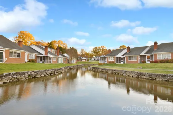 a view of residential houses with lake view