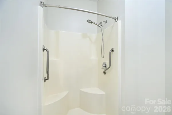 a bathroom with a shower and toilet