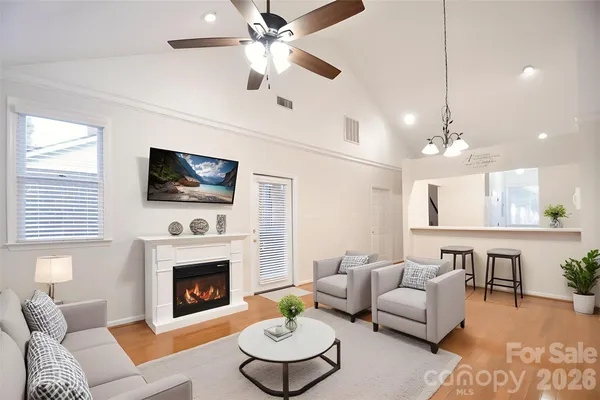 a living room with furniture fireplace and a flat screen tv