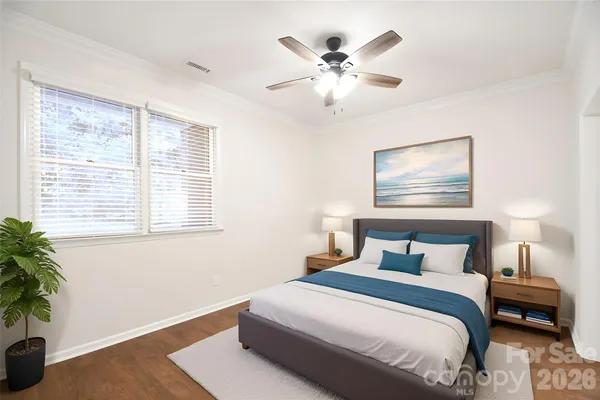 a bedroom with furniture and a window