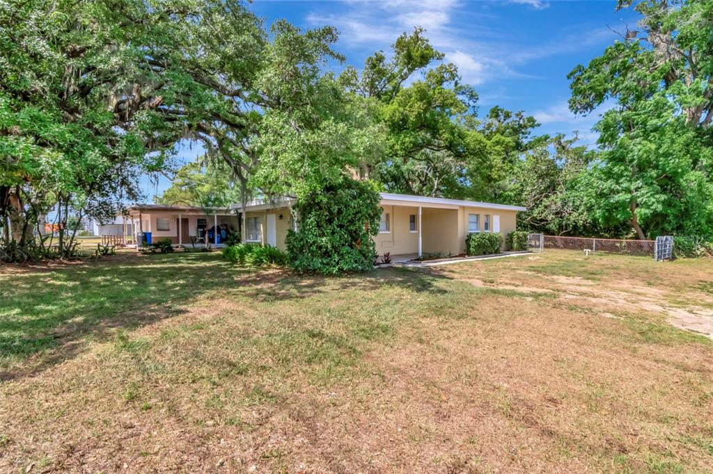 126 Kingsway Road Brandon, FL 33510 - Photo 38 of 42 front view of a house with a yard