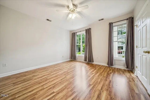a bathroom with a tub a sink and mirror