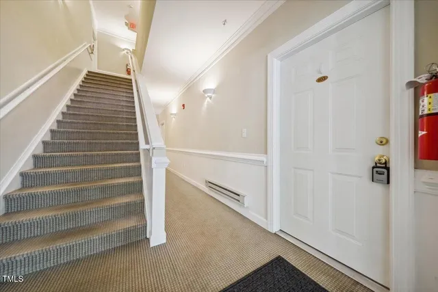 a view of entryway and hall with wooden floor