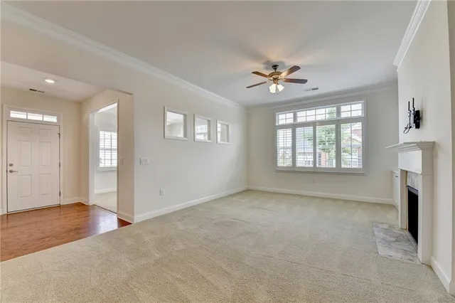 a view of kitchen with refrigerator stove microwave and cabinets