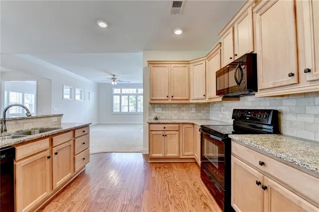a bathroom with a sink vanity and a mirror