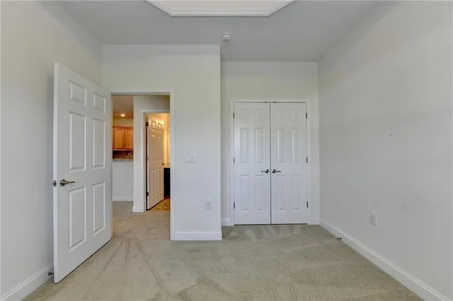 a view of a livingroom with a ceiling fan and window
