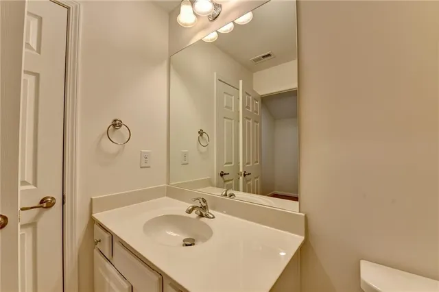 a aerial view of a house with a yard and potted plants