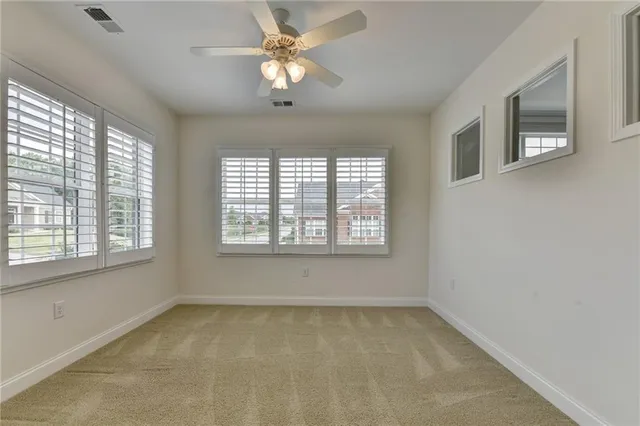 an aerial view of a house with garden space and street view