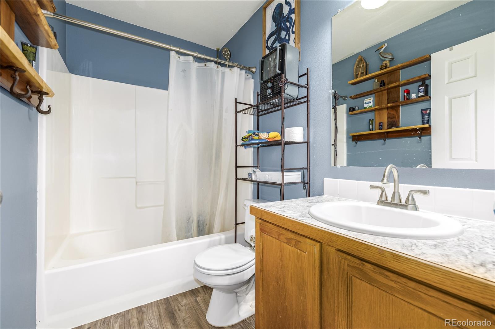 4005 Eagles Nest Drive Evans, CO 80620 - Photo 13 of 26 a bathroom with a sink a toilet and shower