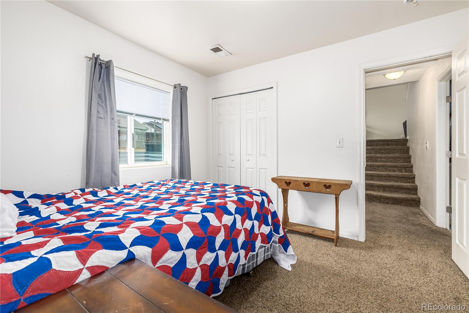4005 Eagles Nest Drive Evans, CO 80620 - Photo 14 of 26 a bedroom with a bed and a dresser