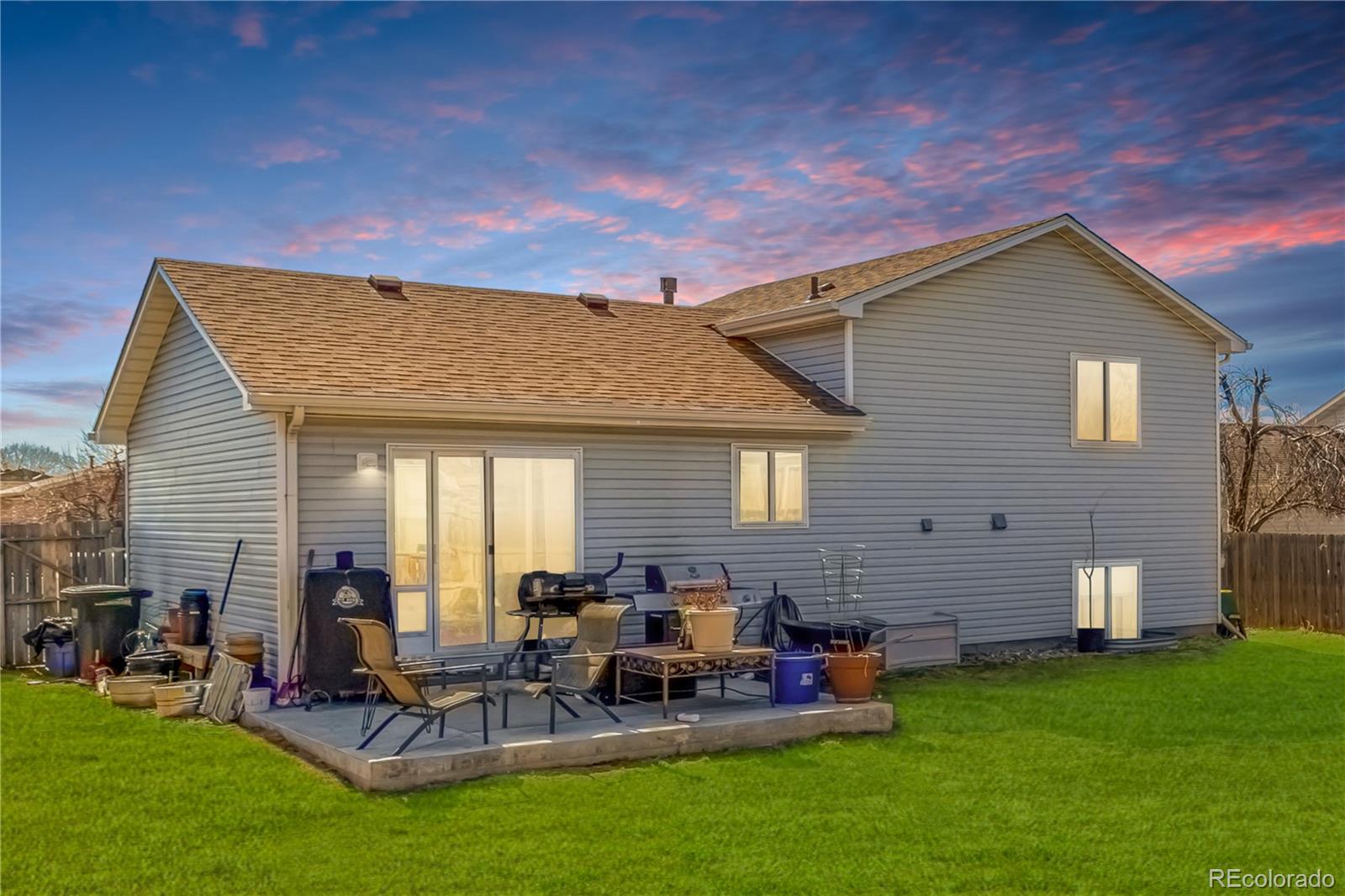 4005 Eagles Nest Drive Evans, CO 80620 - Photo 17 of 26 a view of a house with backyard and a patio
