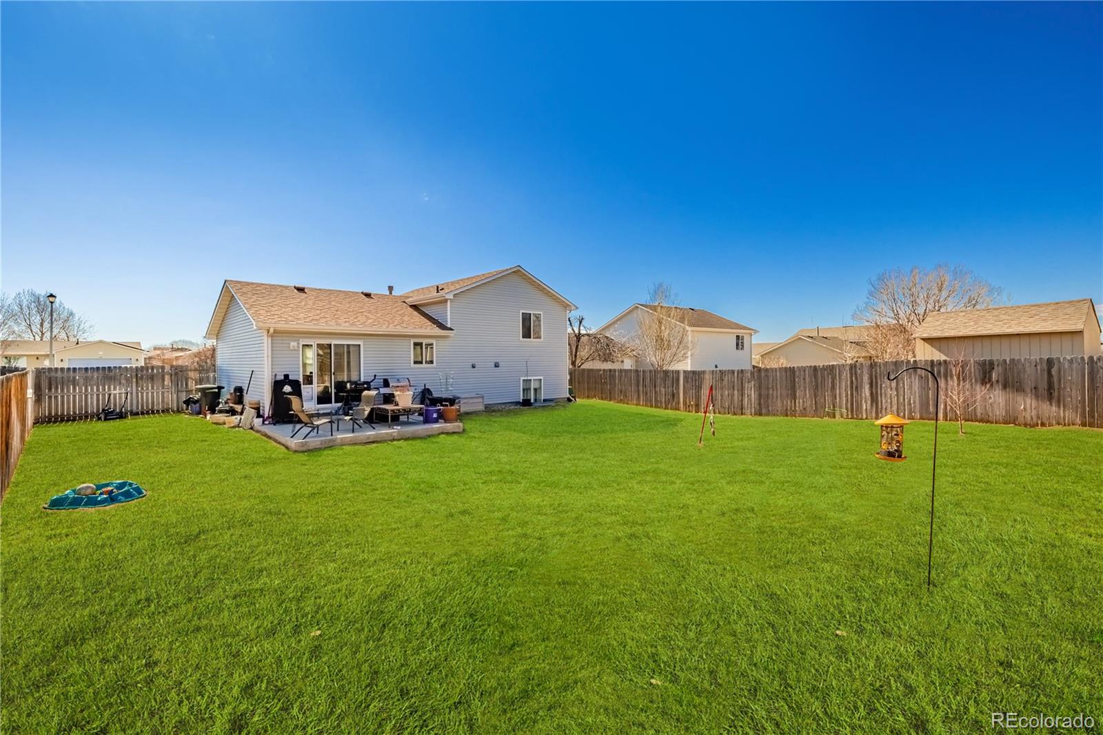 4005 Eagles Nest Drive Evans, CO 80620 - Photo 18 of 26 a view of an house with backyard and pool