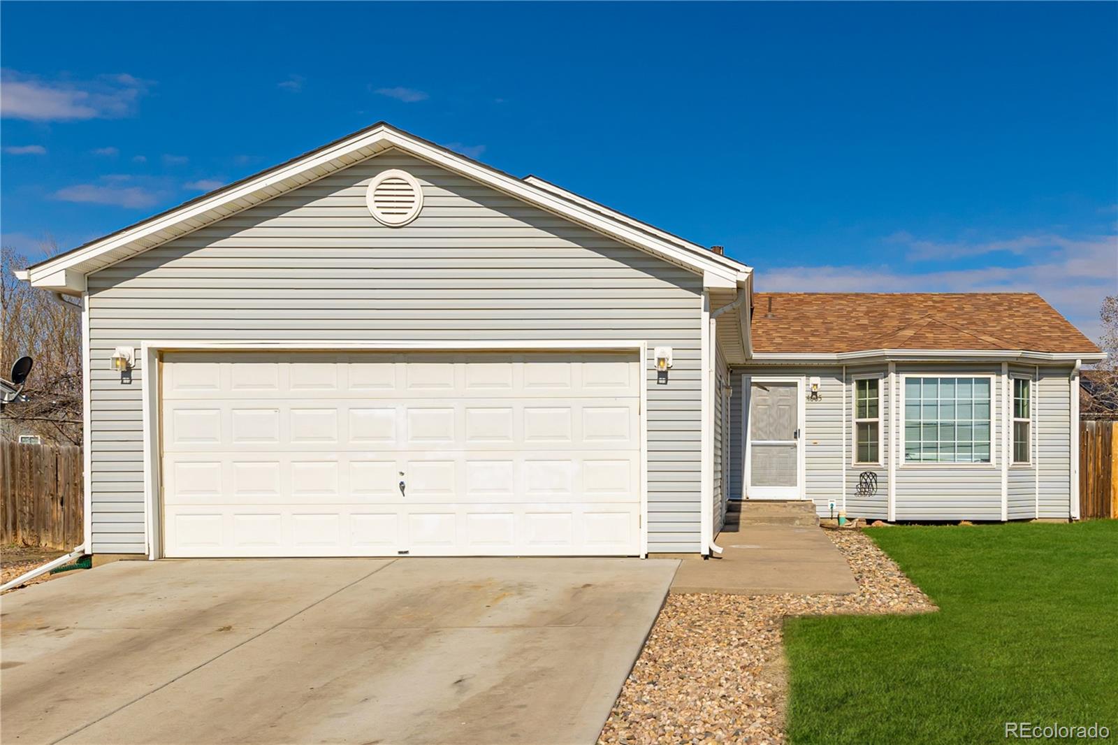 4005 Eagles Nest Drive Evans, CO 80620 - Photo 2 of 26 a front view of a house with a yard