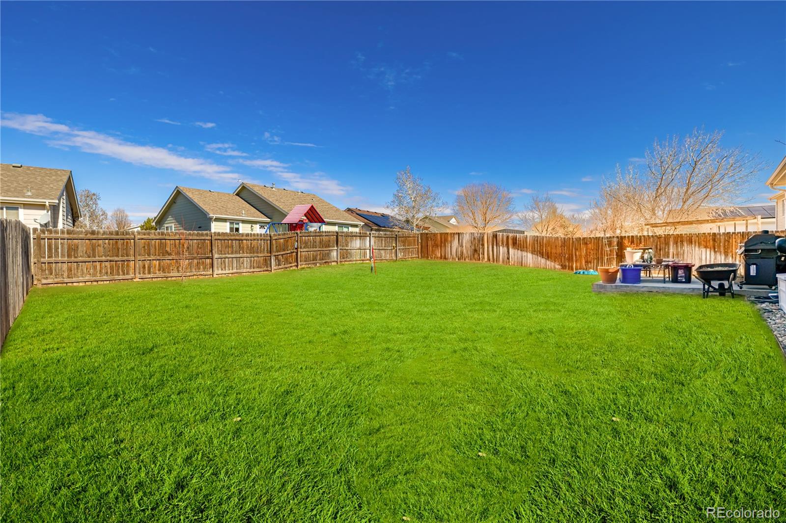 4005 Eagles Nest Drive Evans, CO 80620 - Photo 22 of 26 a view of a yard with a house in the background