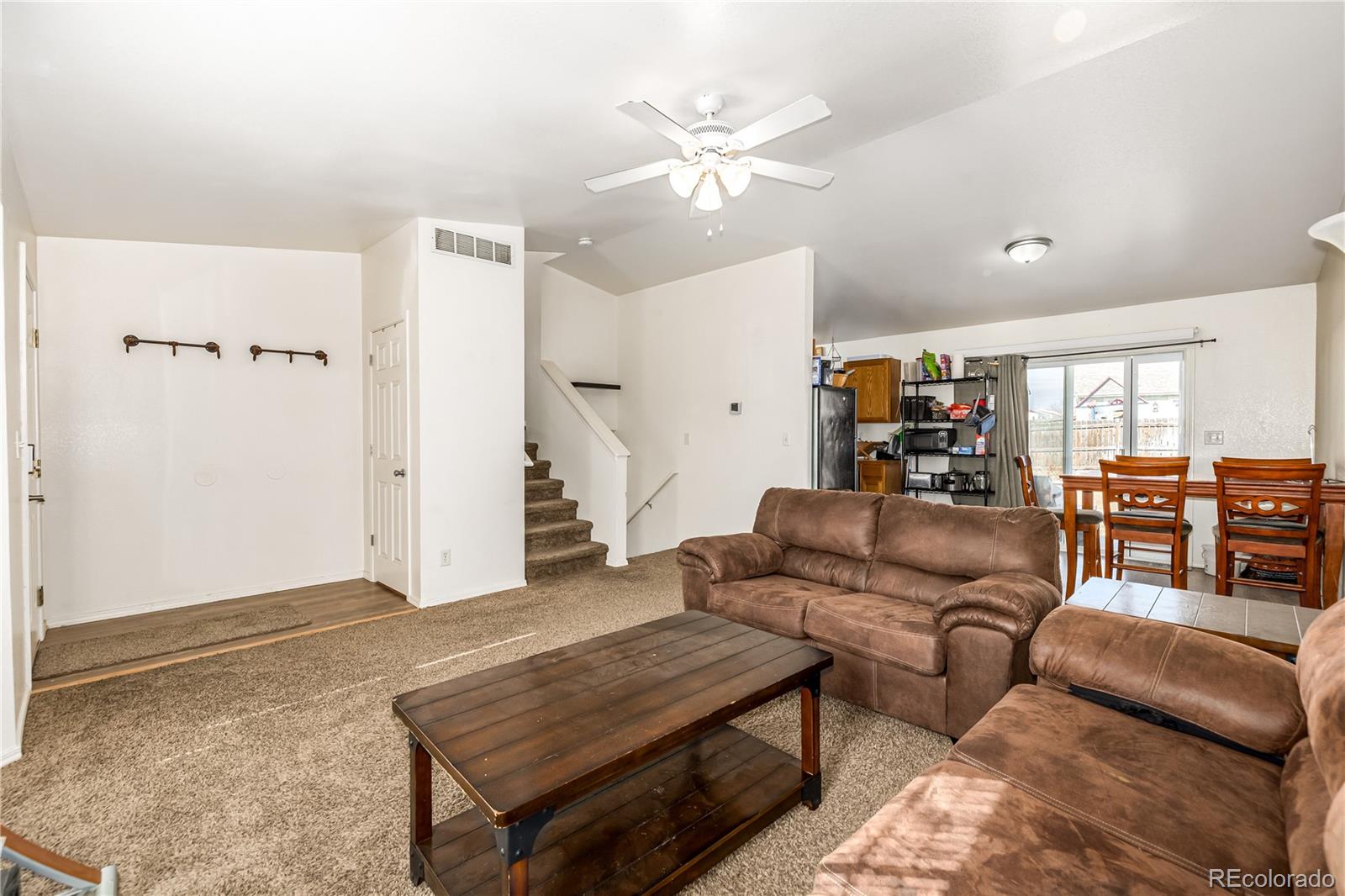 4005 Eagles Nest Drive Evans, CO 80620 - Photo 5 of 26 a living room with furniture and wooden floor