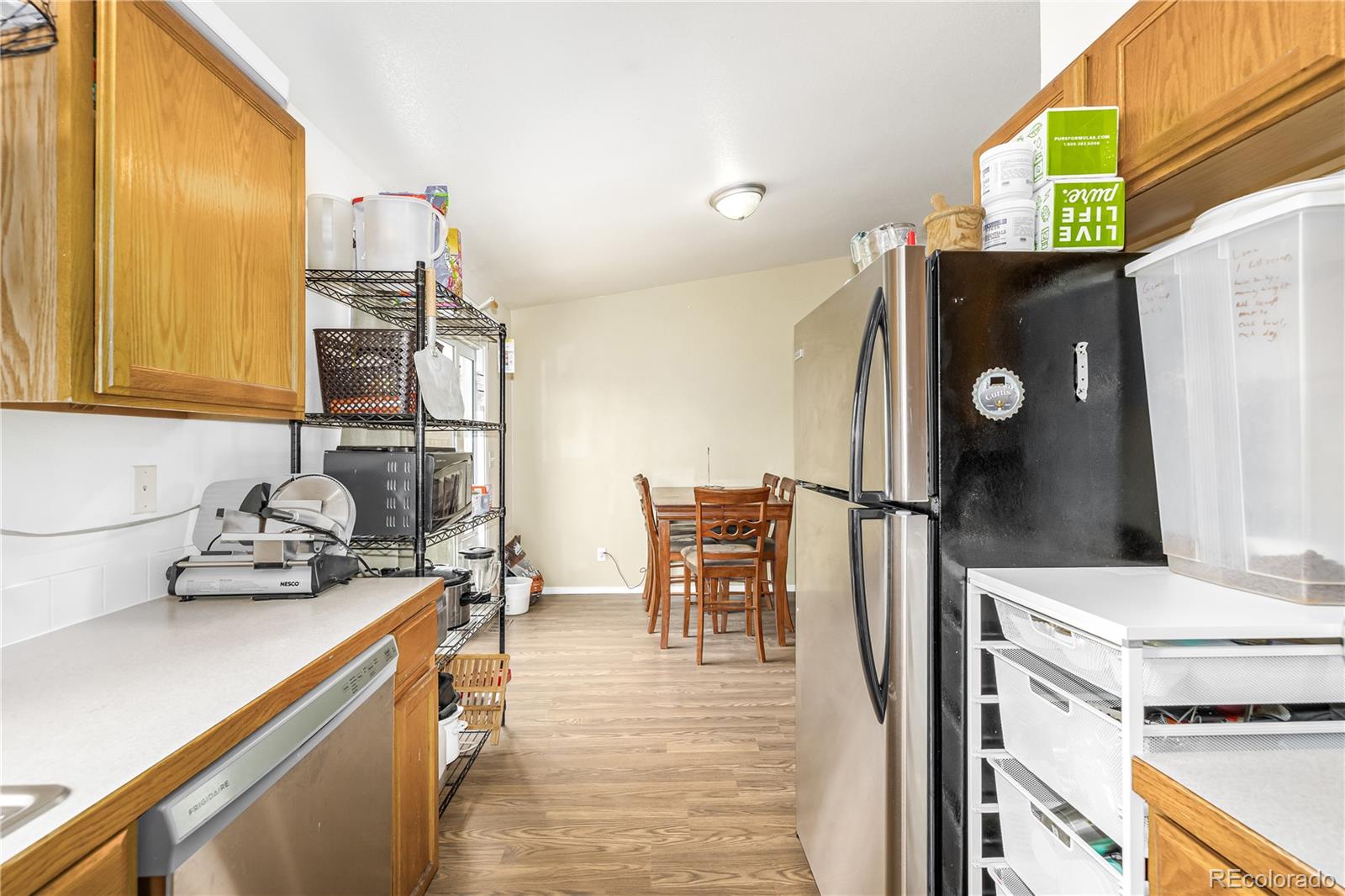 4005 Eagles Nest Drive Evans, CO 80620 - Photo 7 of 26 a kitchen with a sink appliances and cabinets