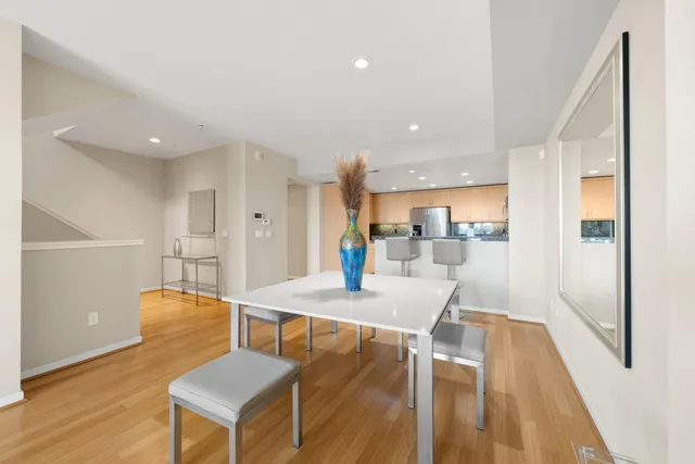 a view of a dining room with furniture and wooden floor