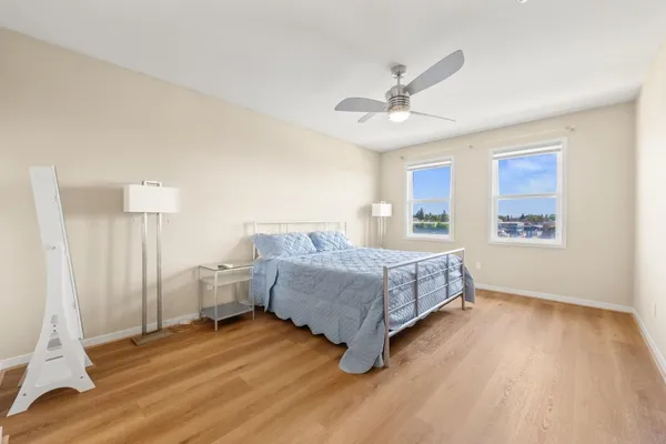 a bedroom with a bed and a window