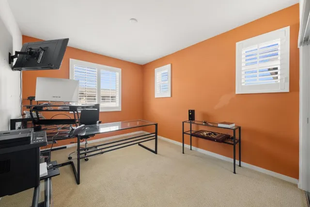 a spacious bathroom with a double vanity sink toilet mirror and bathtub