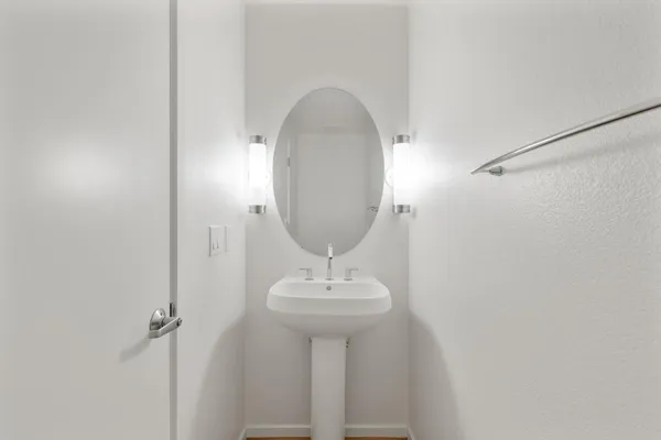 an empty room with closet and a chandelier fan