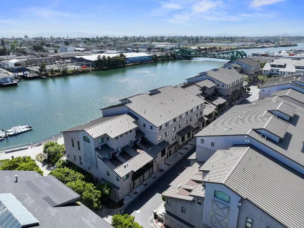 an aerial view of a house with a lake view