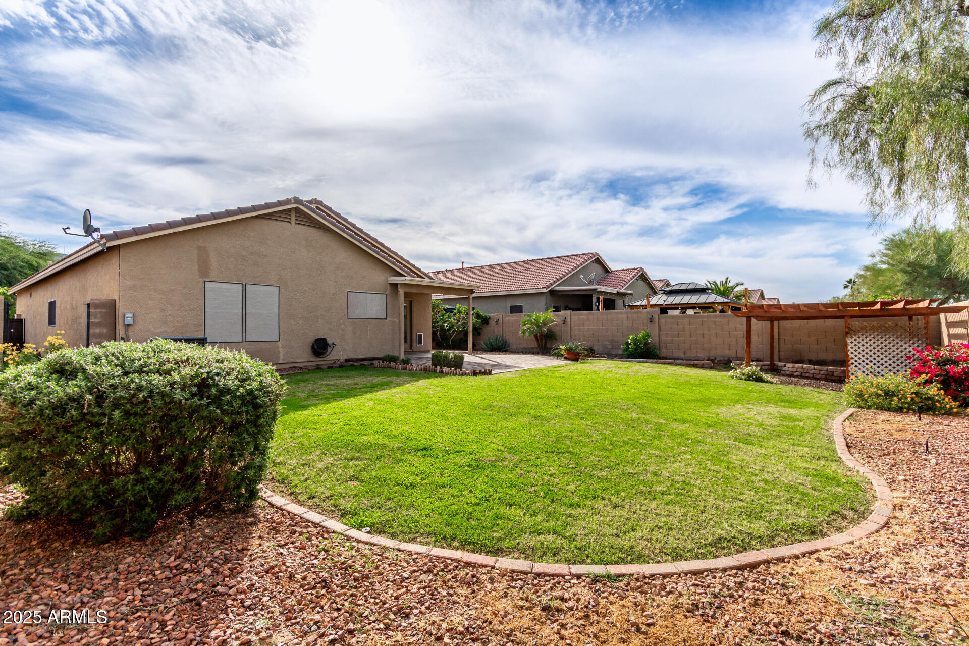 1126 East Pedro Road Phoenix, AZ 85042 - Photo 24 of 34 a view of a house with a backyard