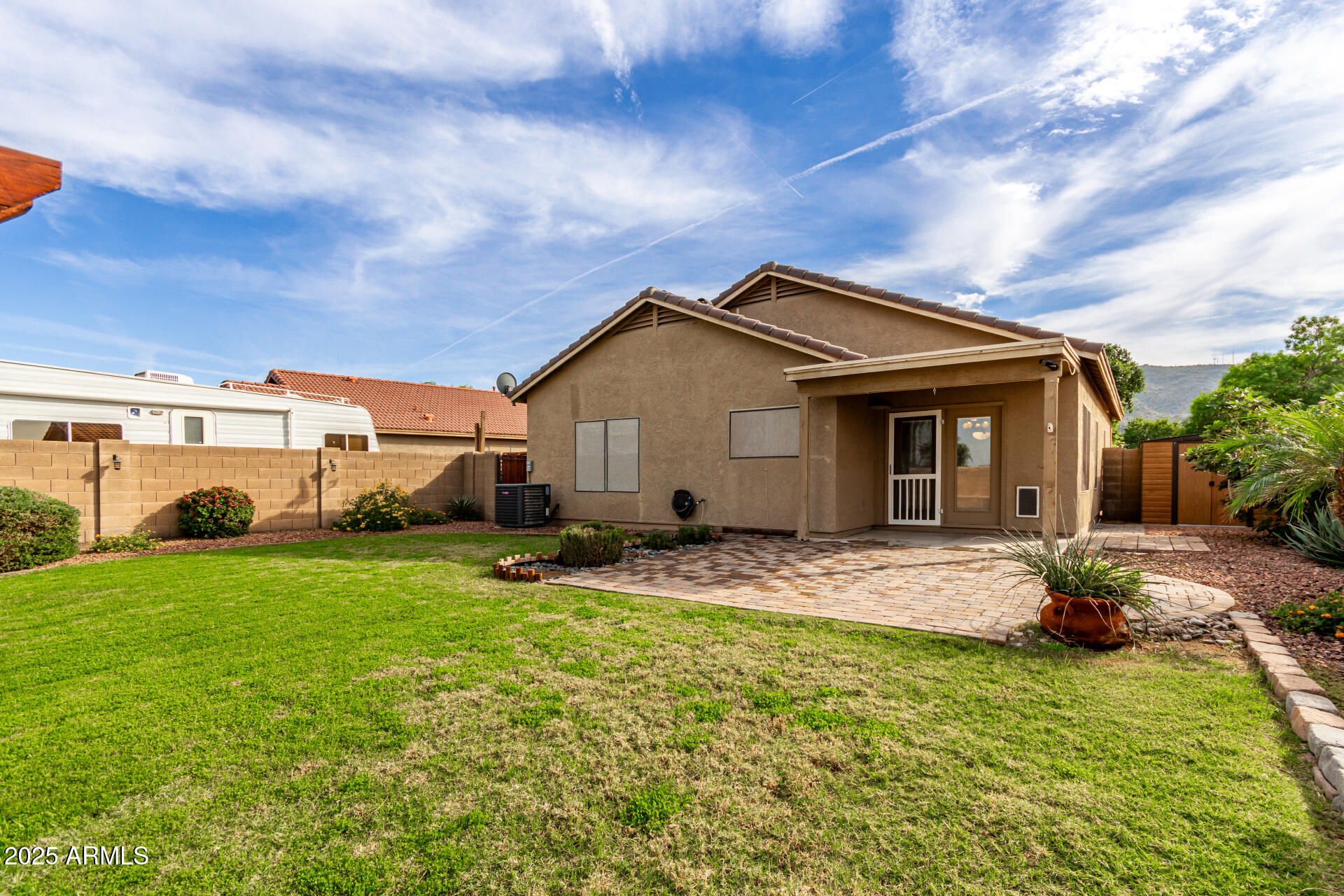 1126 East Pedro Road Phoenix, AZ 85042 - Photo 27 of 34 a front view of a house with garden