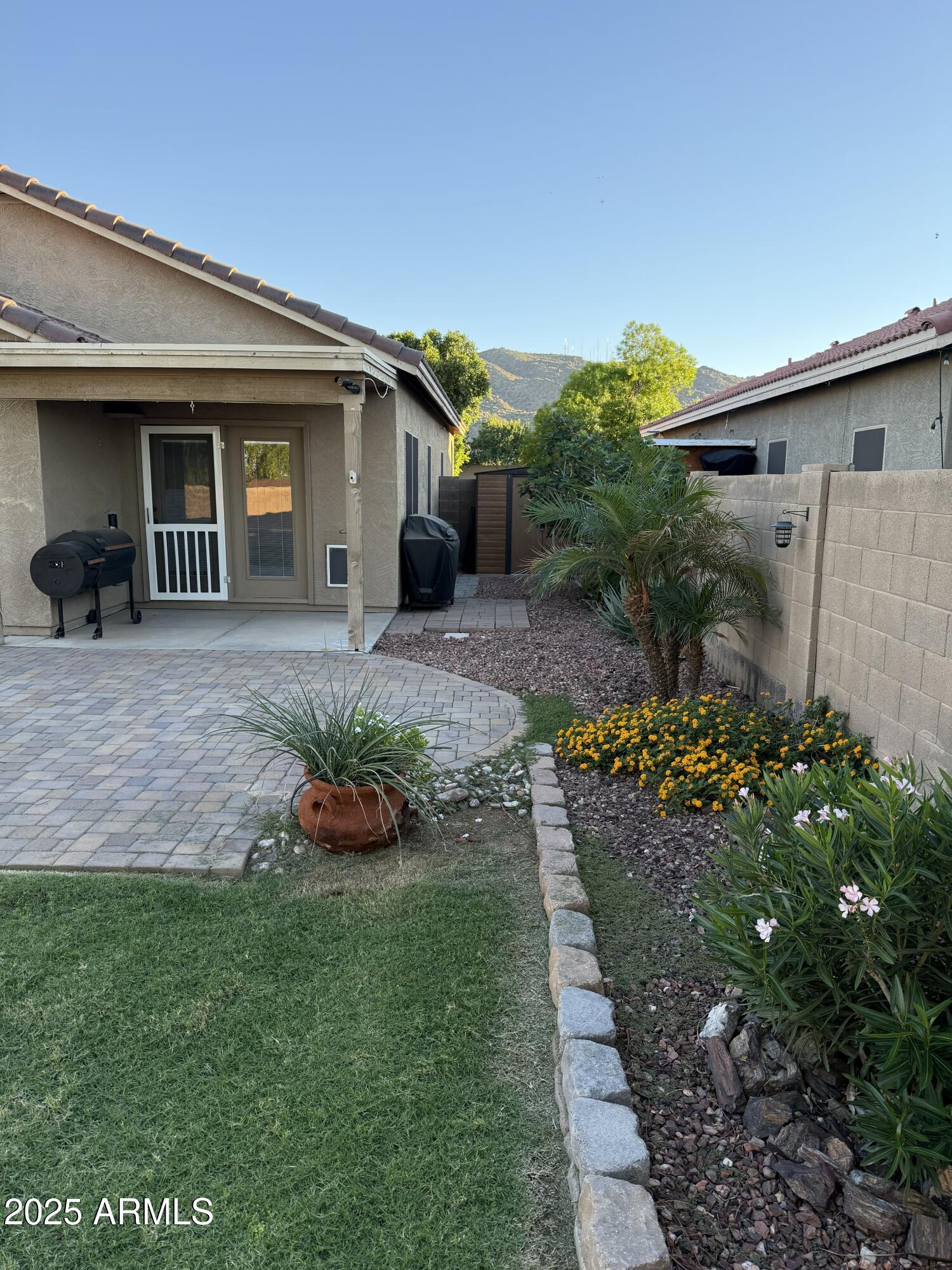 1126 East Pedro Road Phoenix, AZ 85042 - Photo 30 of 34 a front view of a house with a yard and outdoor seating
