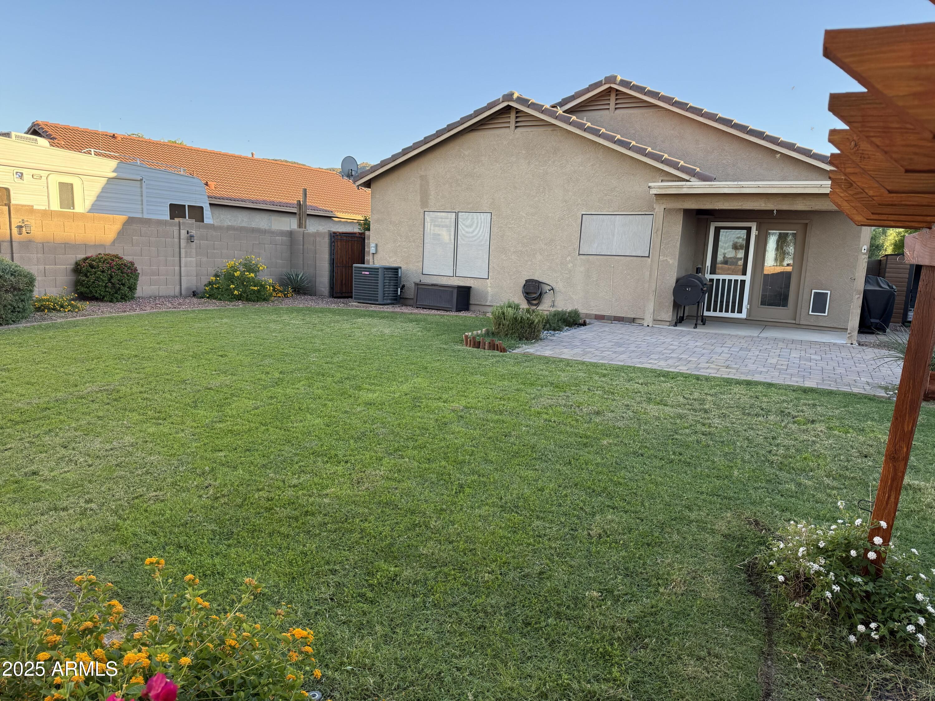1126 East Pedro Road Phoenix, AZ 85042 - Photo 31 of 34 a view of a yard in front of a house