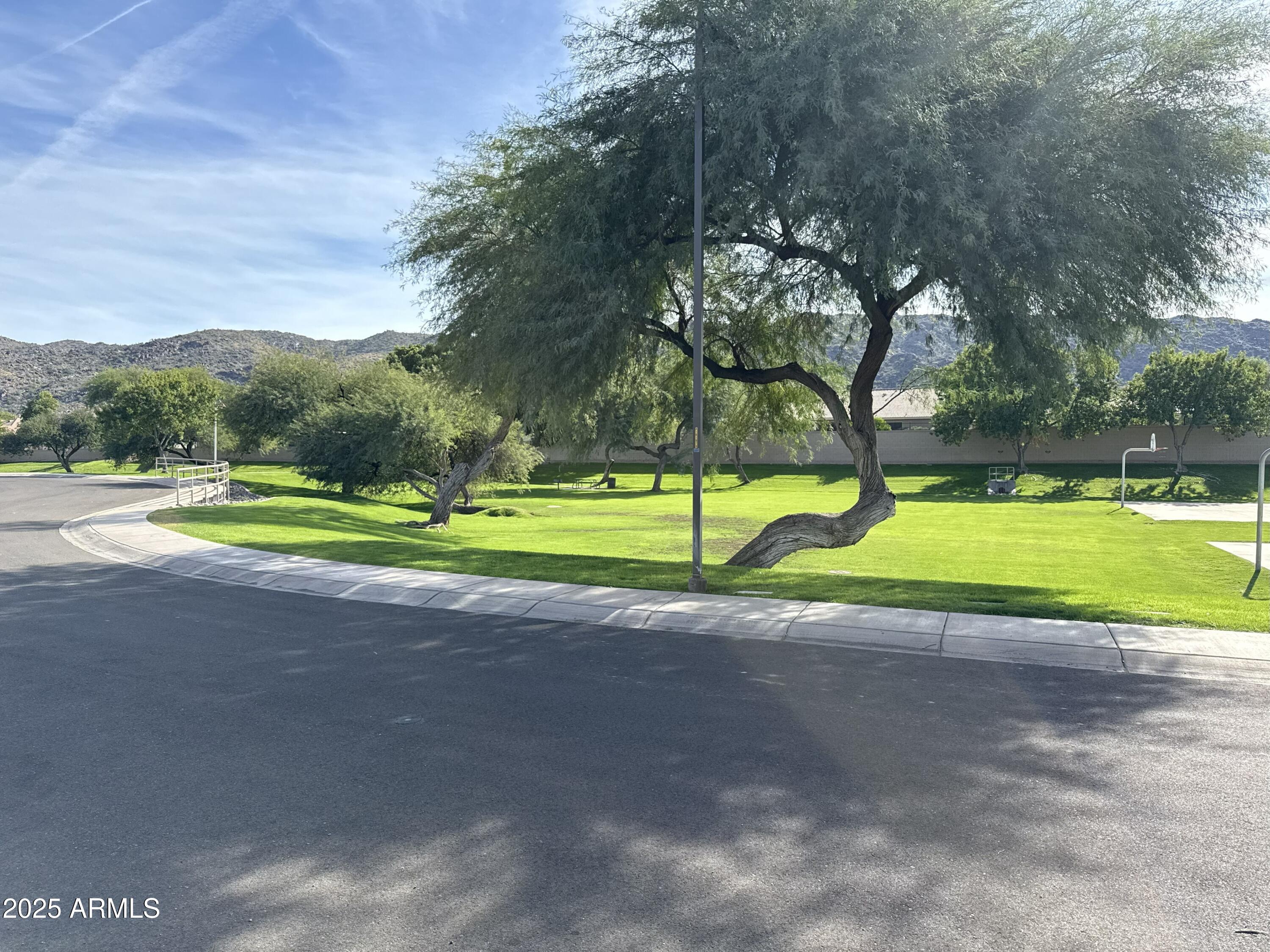 1126 East Pedro Road Phoenix, AZ 85042 - Photo 33 of 34 a view of a park with swings and slides