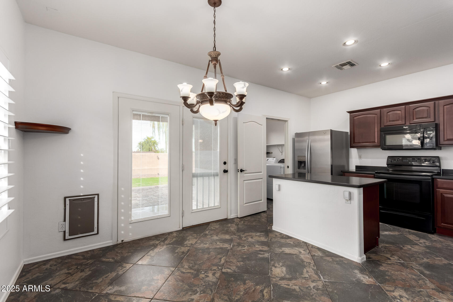1126 East Pedro Road Phoenix, AZ 85042 - Photo 9 of 34 a kitchen with stainless steel appliances a refrigerator sink and stove