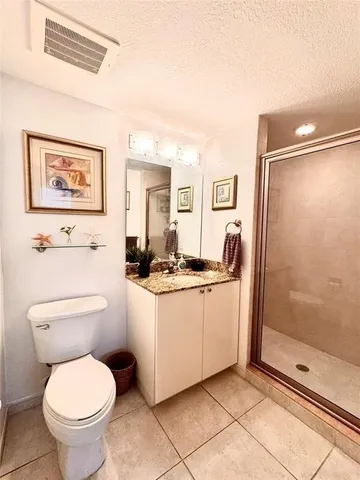 a bathroom with a toilet sink and shower