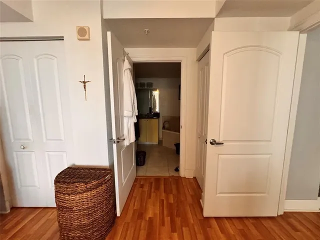 a view of bedroom with wooden floor