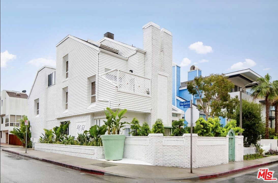 138 Roma Court Marina del Rey, CA 90292 - Photo 1 of 38 a front view of a house with a garden
