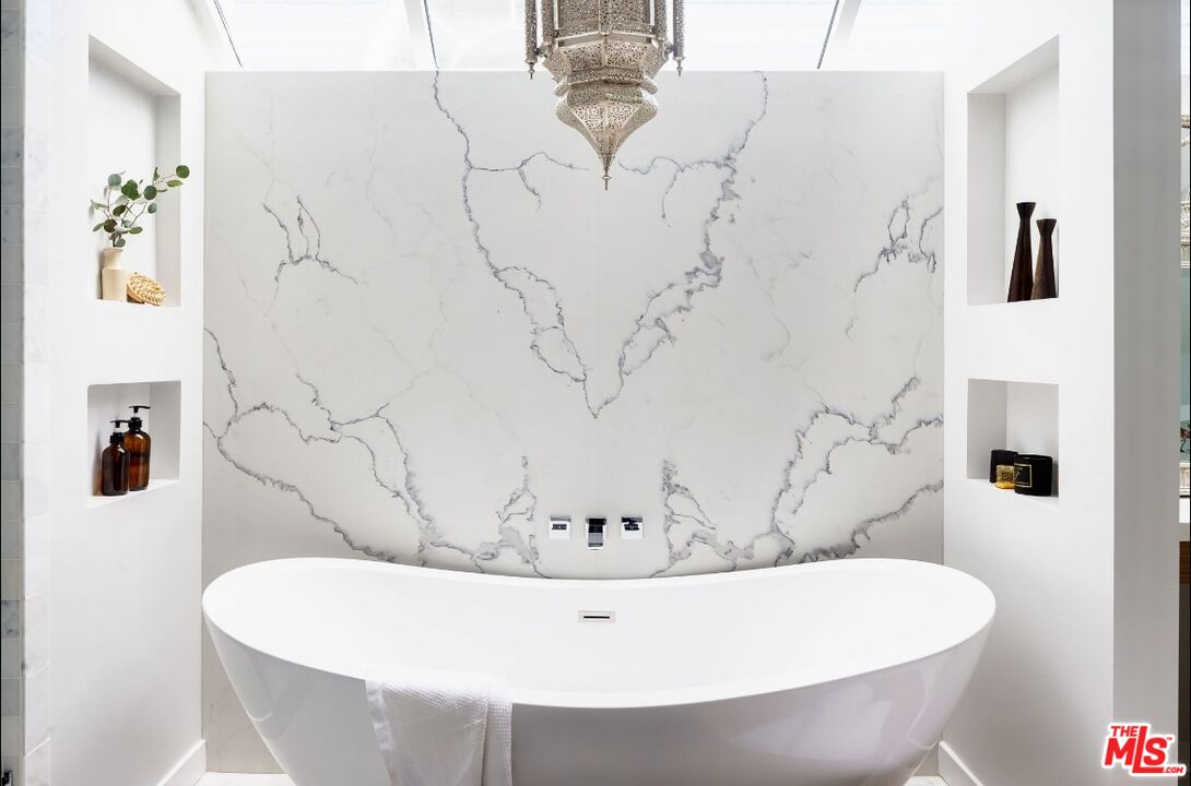 138 Roma Court Marina del Rey, CA 90292 - Photo 24 of 38 a white bath tub sitting in a bathroom