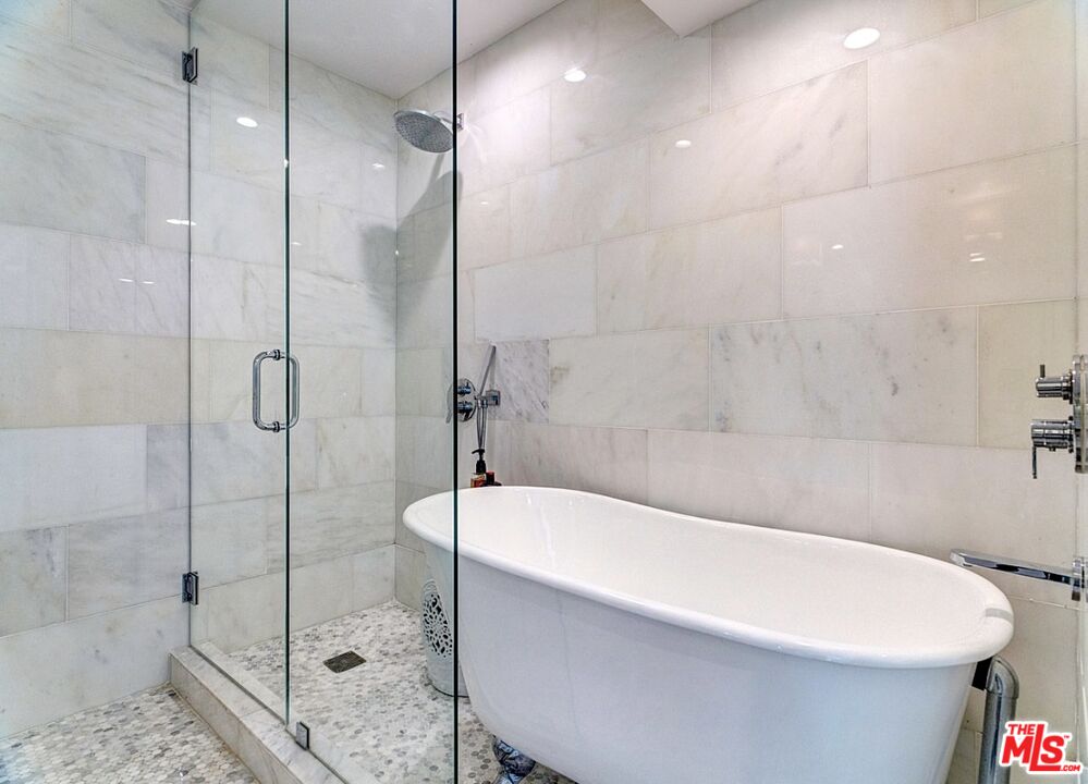138 Roma Court Marina del Rey, CA 90292 - Photo 33 of 38 a white bath tub sitting next to a shower