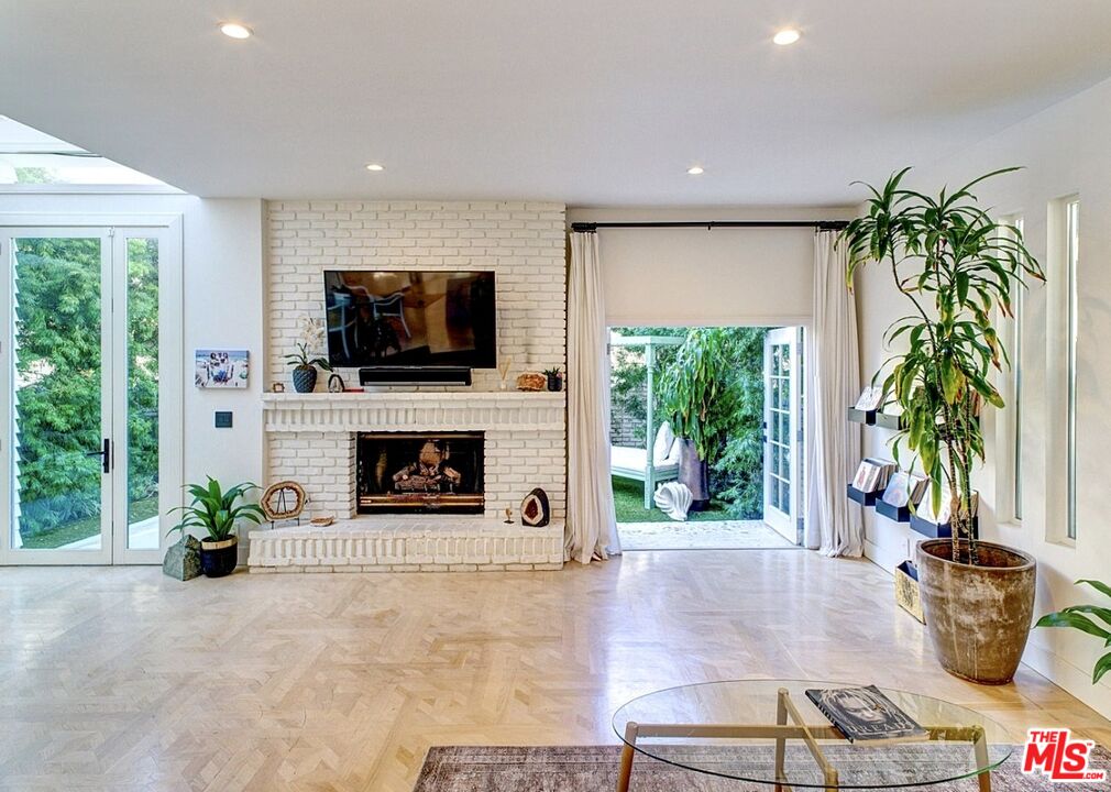 138 Roma Court Marina del Rey, CA 90292 - Photo 6 of 38 a living room with furniture a fireplace and a flat screen tv