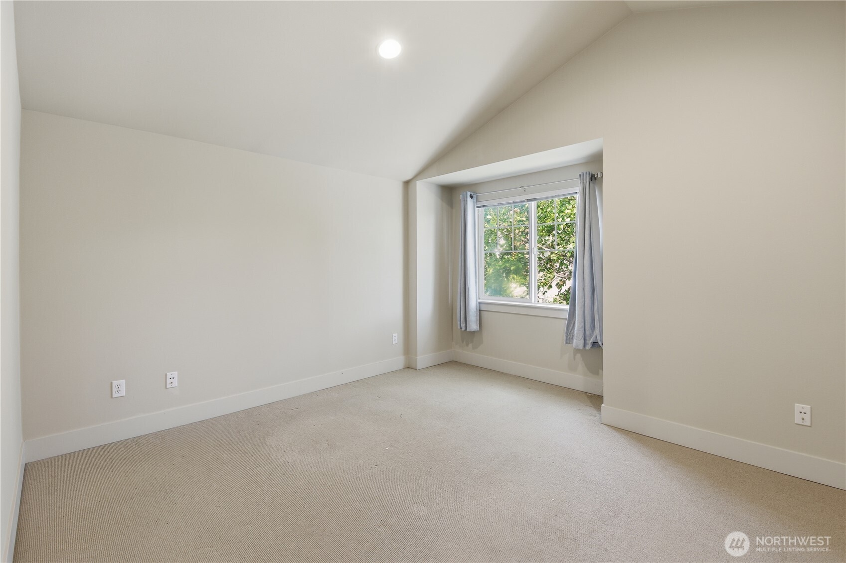 723 North 95th Street, Unit A Seattle, WA 98103 - Photo 14 of 20 an empty room with windows