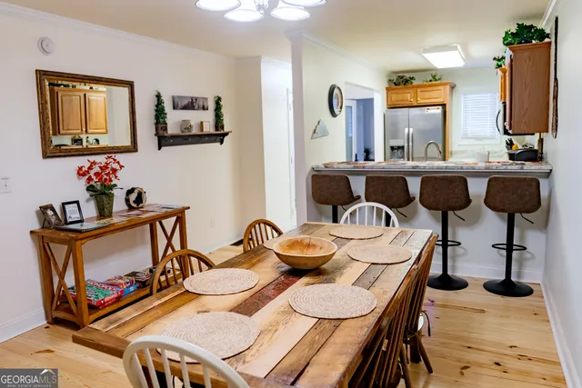 a bathroom with a sink a toilet and shower curtain