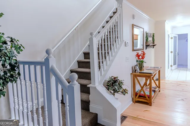 a bedroom with a bed and a mirror