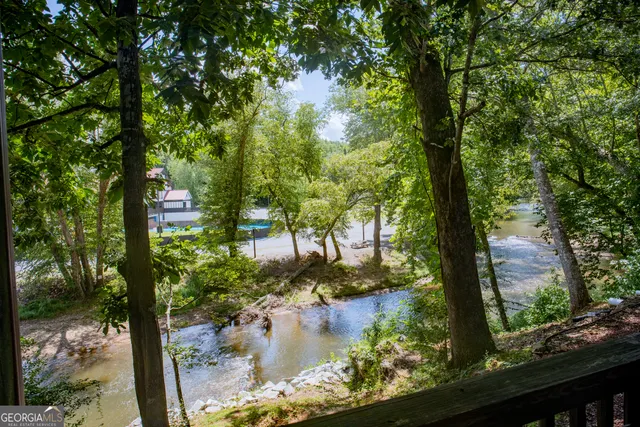 a kitchen with stainless steel appliances granite countertop a refrigerator stove and microwave