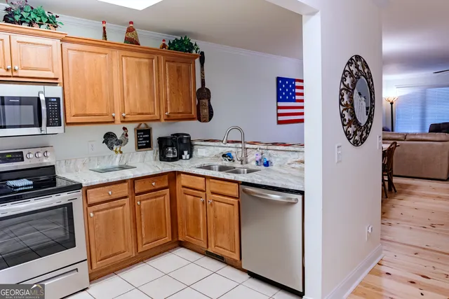 a view of a dining room with furniture a fireplace and wooden floor