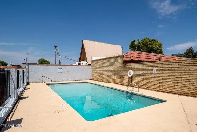 a view of a swimming pool with a lounge chairs