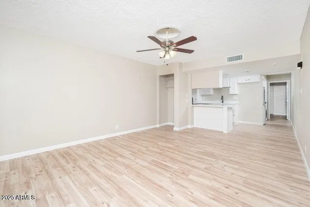 a view of a kitchen with a dishwasher and a refrigerator
