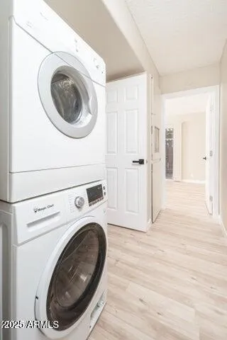 a view of a storage and utility room with washer and dryer