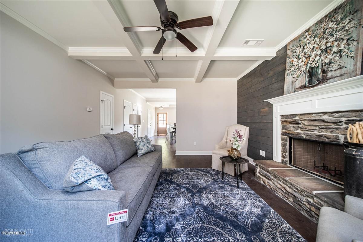 339 Walnut Grove Road Gray, GA 31032 - Photo 13 of 30 a living room with furniture and a fireplace