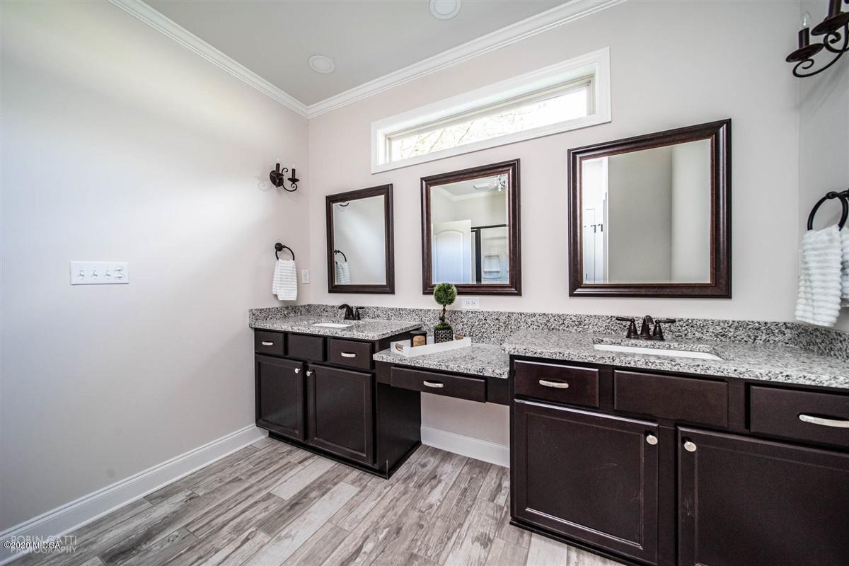 339 Walnut Grove Road Gray, GA 31032 - Photo 18 of 30 a bathroom with a sink and a mirror