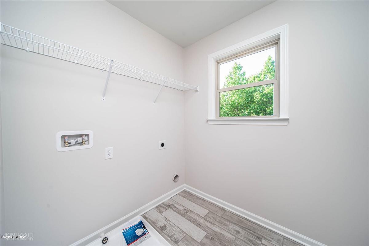 339 Walnut Grove Road Gray, GA 31032 - Photo 26 of 30 a view of a small space with wooden floor and a window